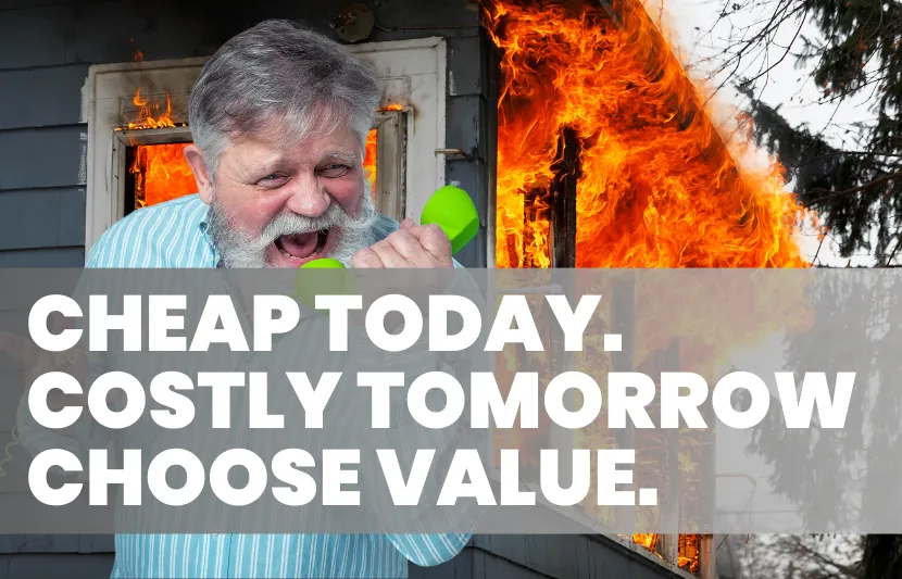 Man standing in front of a burning house with bold text overlay saying Cheap Today, Costly Tomorrow, Choose Value – visual metaphor for risks of cheap conveyancing fees.